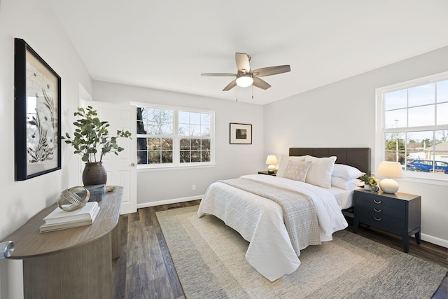 bedroom featuring dark hardwood / wood-style flooring and ceiling fan