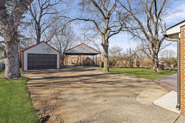 exterior space featuring a garage, an outdoor structure, a carport, and a gazebo