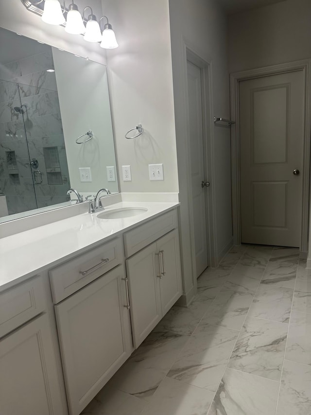 bathroom featuring vanity and an enclosed shower