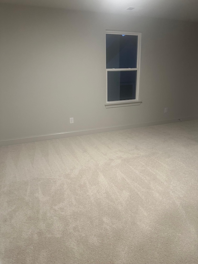 unfurnished room featuring carpet floors