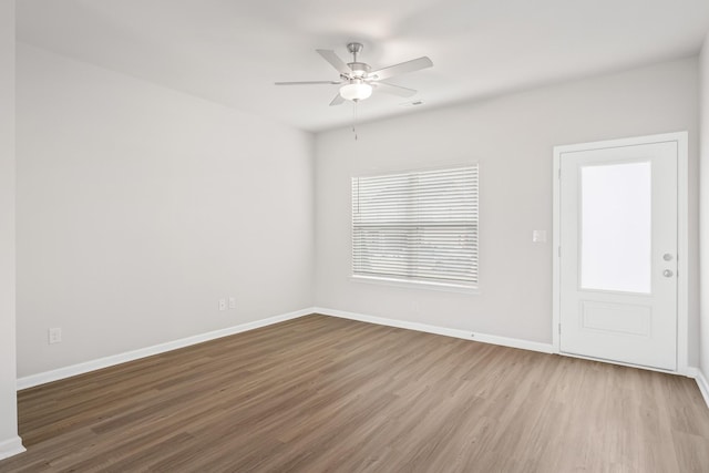 unfurnished room with ceiling fan and light hardwood / wood-style floors