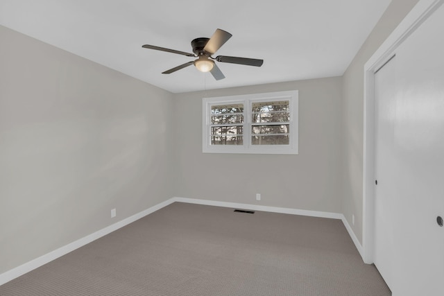 unfurnished bedroom featuring carpet floors, a closet, and baseboards