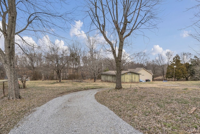 exterior space with gravel driveway and an outdoor structure