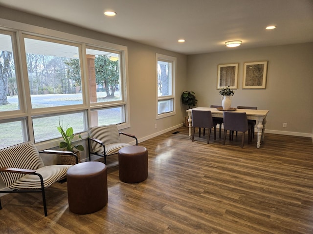 dining room featuring baseboards, dark wood finished floors, and recessed lighting