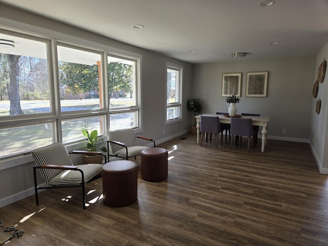 interior space featuring baseboards, dark wood finished floors, and recessed lighting