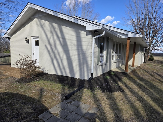 view of home's exterior featuring brick siding