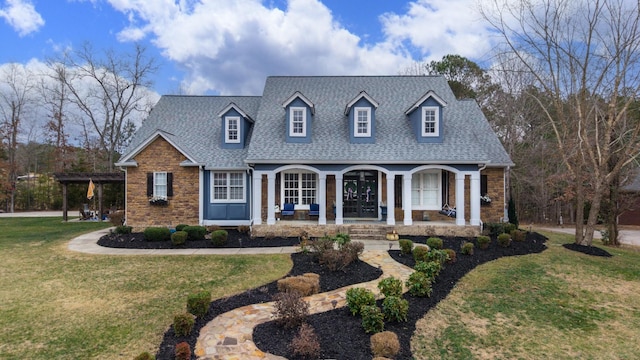 cape cod-style house with a front lawn and a porch