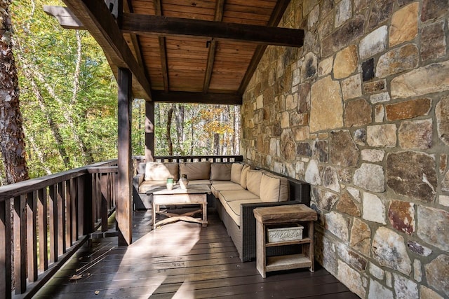 wooden deck with an outdoor living space