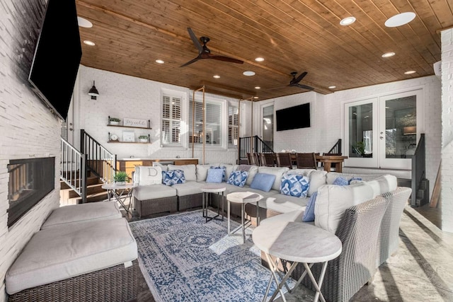 view of patio with entry steps, ceiling fan, french doors, and an outdoor hangout area