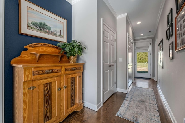 interior space with dark wood finished floors, recessed lighting, crown molding, and baseboards