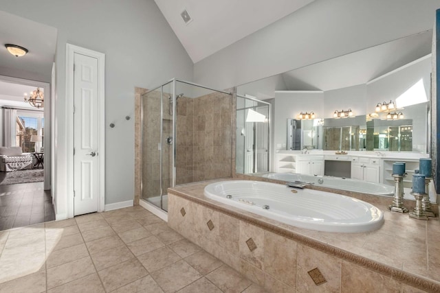 bathroom featuring tile patterned floors, shower with separate bathtub, a chandelier, vaulted ceiling, and vanity