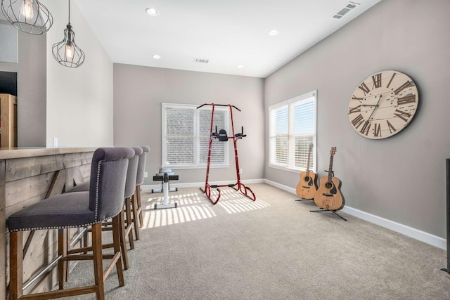 exercise area with visible vents, recessed lighting, carpet floors, a bar, and baseboards