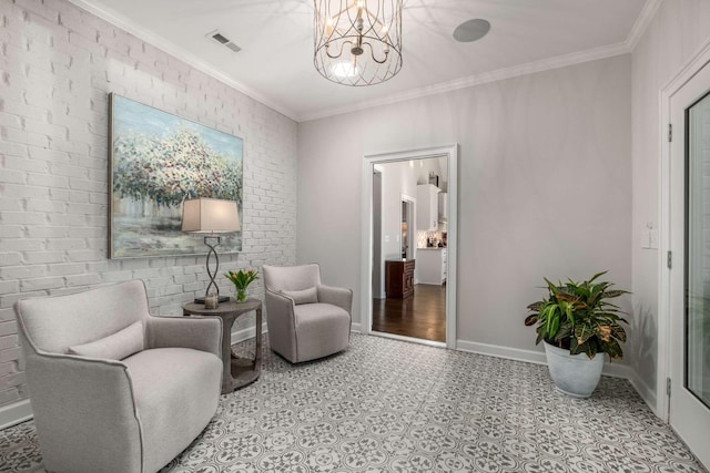 sitting room with ornamental molding, brick wall, and an inviting chandelier