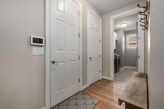 interior space with washer and dryer and light wood-type flooring