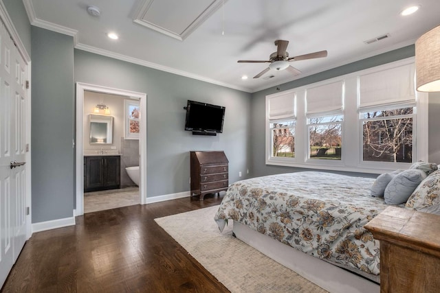 bedroom featuring recessed lighting, wood finished floors, baseboards, and ornamental molding