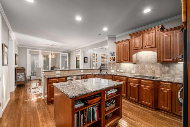 kitchen with a kitchen island, dishwasher, backsplash, black electric stovetop, and kitchen peninsula