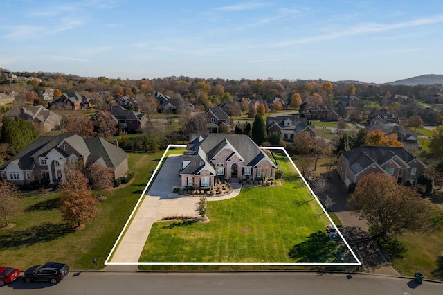 birds eye view of property with a residential view