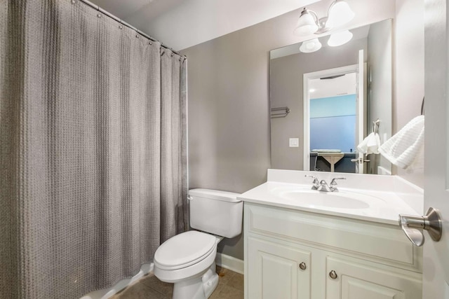 bathroom featuring tile patterned floors, curtained shower, toilet, and vanity