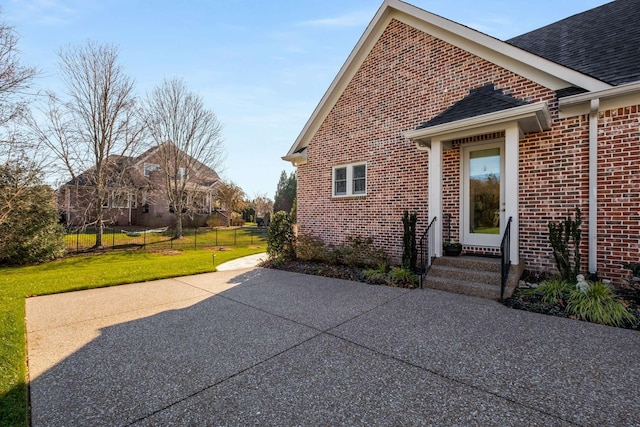 exterior space with a yard and a patio area