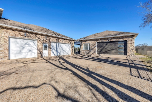 back of house featuring a garage