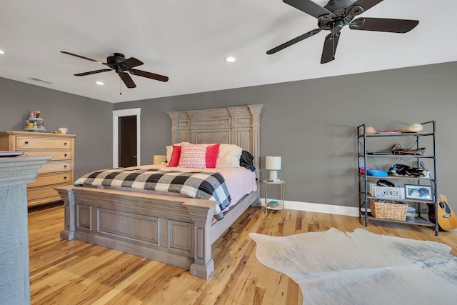 bedroom featuring light hardwood / wood-style flooring and ceiling fan