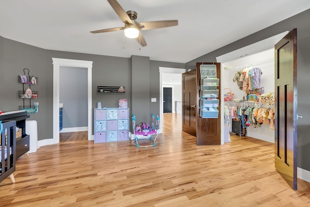 interior space with ceiling fan and light hardwood / wood-style flooring