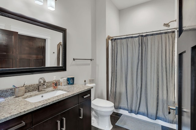 full bathroom with vanity, toilet, and shower / bath combo with shower curtain