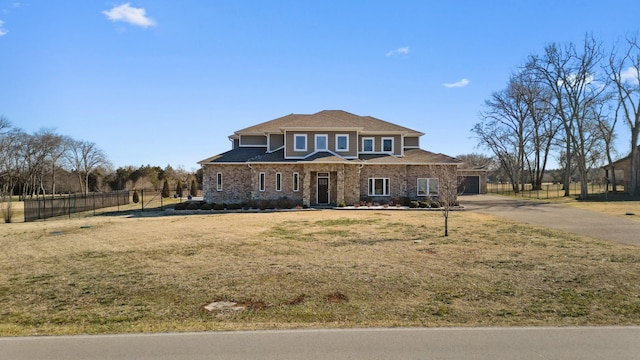 view of front facade featuring a garage and a front yard