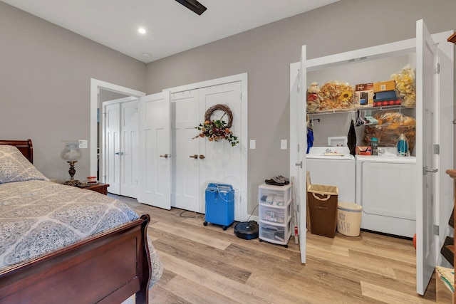 bedroom with ceiling fan, washing machine and clothes dryer, and light wood-type flooring