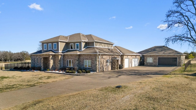 view of front of home featuring a garage and a front lawn