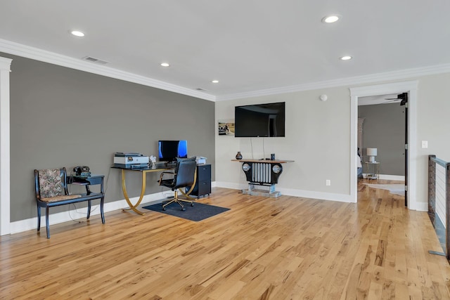 office area with light hardwood / wood-style flooring and ornamental molding