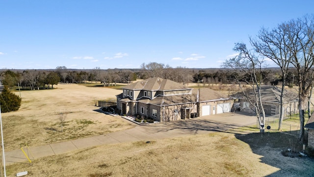 exterior space featuring a rural view and a garage