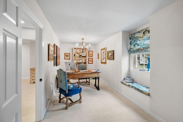 home office with an inviting chandelier and light colored carpet