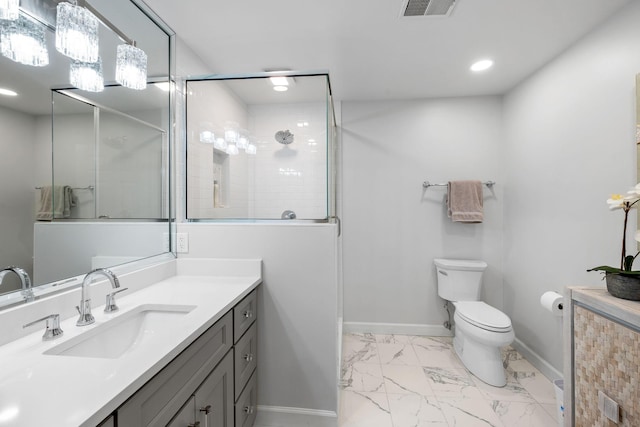 bathroom with vanity, toilet, and walk in shower