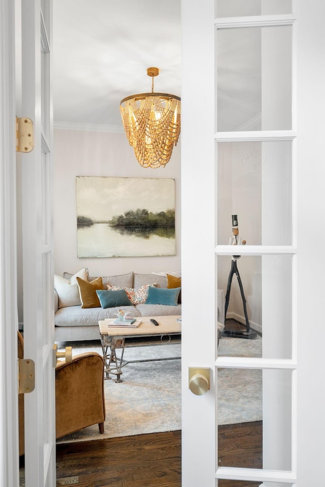 interior space with crown molding, hardwood / wood-style flooring, breakfast area, and a notable chandelier