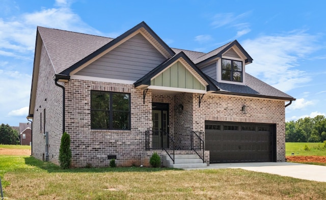 view of front of home featuring a garage and a front yard