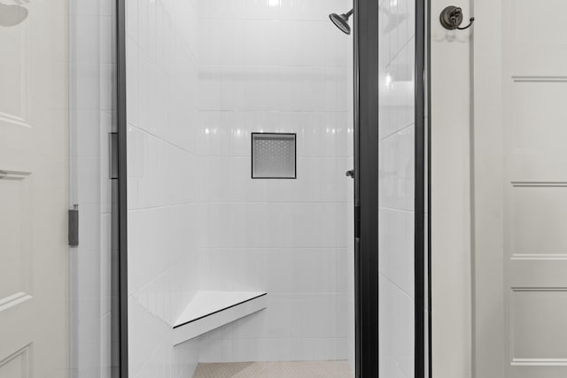 bathroom with a shower with shower door