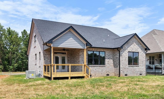 back of property featuring a yard, central AC, french doors, and a deck