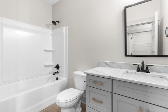 full bathroom featuring shower / tub combination, vanity, toilet, and hardwood / wood-style floors