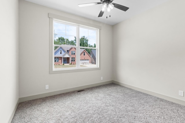 empty room with ceiling fan and carpet flooring