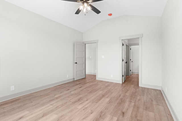 unfurnished bedroom with lofted ceiling, light wood-type flooring, and ceiling fan