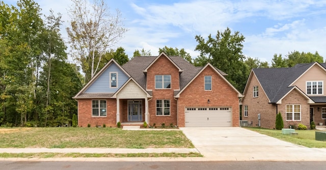 view of front of home featuring a garage and a front lawn