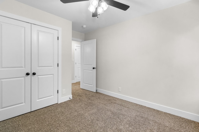 unfurnished bedroom with a closet, ceiling fan, and carpet flooring