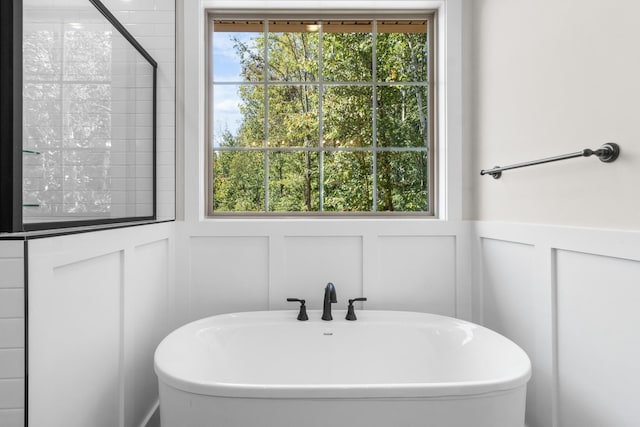 bathroom featuring shower with separate bathtub