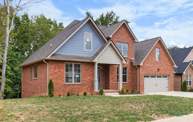 view of front of home with a garage and a front yard