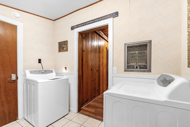 clothes washing area featuring independent washer and dryer, ornamental molding, and light tile patterned floors