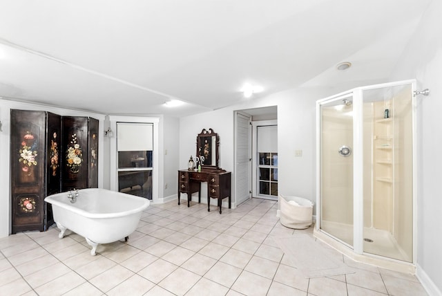 bathroom with independent shower and bath and tile patterned flooring