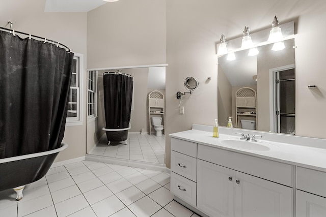 bathroom with vanity, tile patterned floors, and toilet