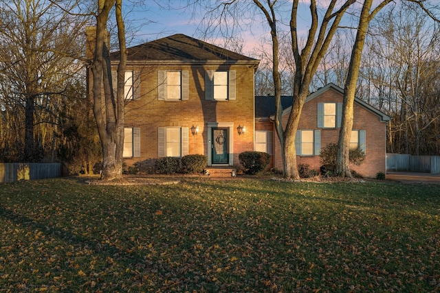 view of property featuring a yard