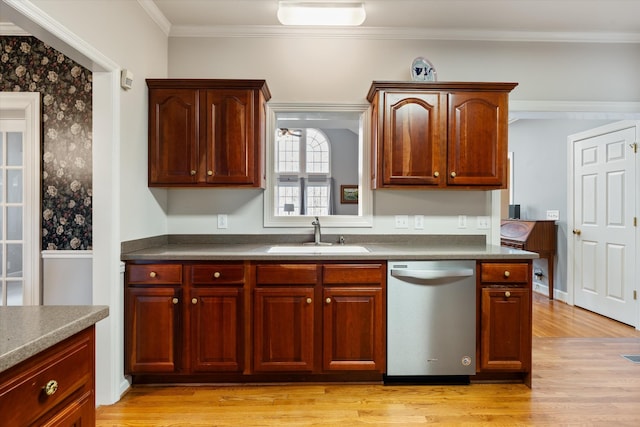 kitchen featuring crown molding, dishwasher, sink, and light wood-type flooring